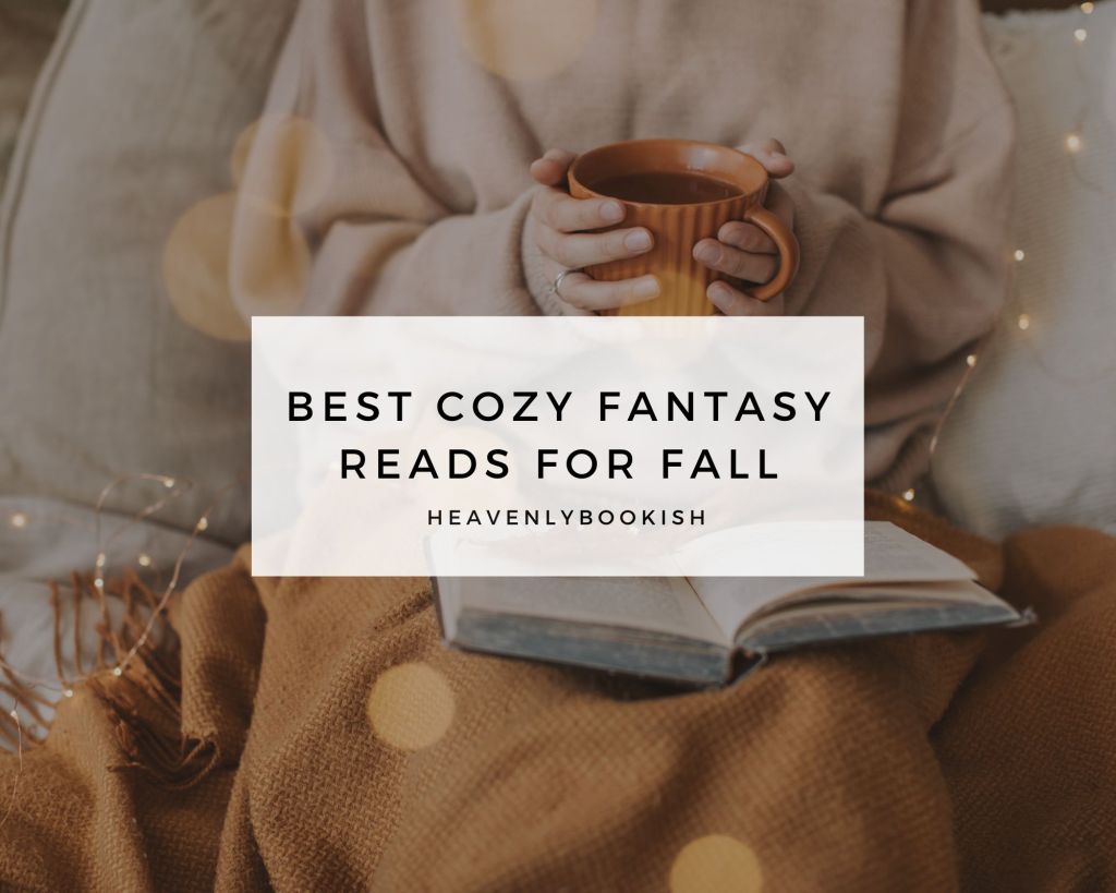 Cover of the blog post. A cozy scene with a person wearing a beige sweater holding a warm orange mug while sitting under a brown blanket. An open book rests on their lap, surrounded by soft, warm lighting. The text reads 'Best Cozy Fantasy Reads for Fall' and 'heavenlybookish' overlaid on the center of the image.