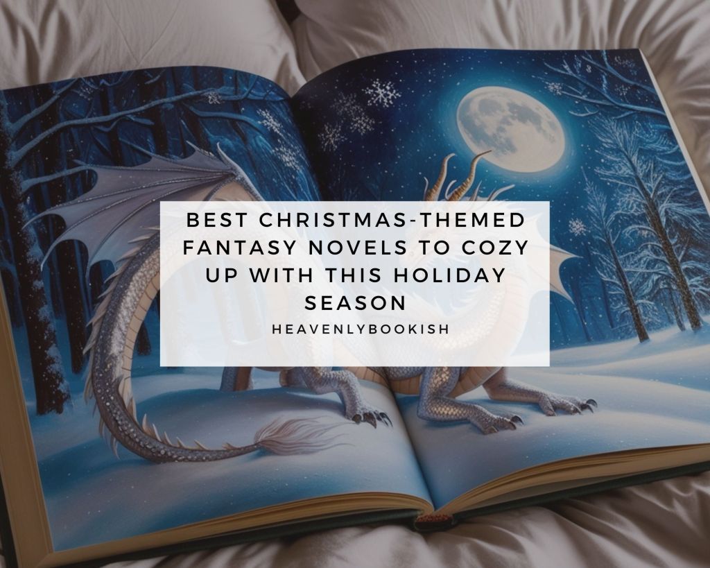 The image shows an open book featuring a fantasy illustration of a dragon in a snowy, moonlit forest with snow-covered trees and a glowing full moon. Overlaid on the image is a white text box with the title "Best Christmas-themed fantasy novels to cozy up with this holiday season" and the credit "heavenlybookish." The background suggests a cozy setting, possibly on a bed with soft blankets, enhancing the warm holiday vibe.